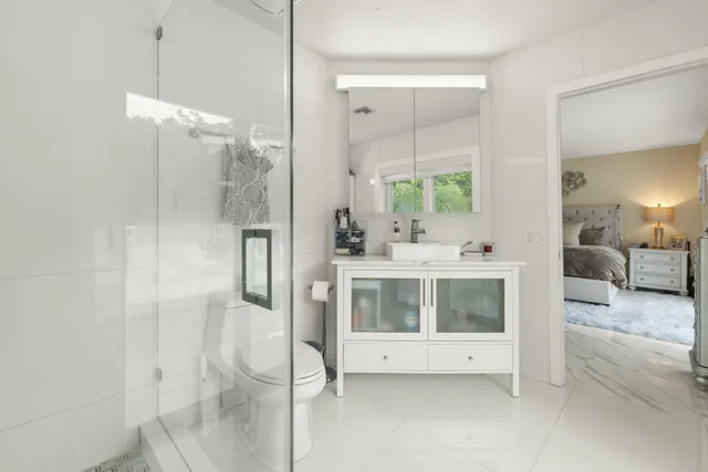 a bathroom with a double vanity sink and mirror