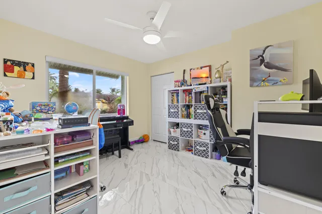 a view of a workspace with furniture and toys