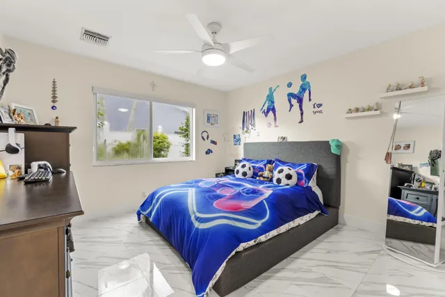 a bedroom with a bed and a couch