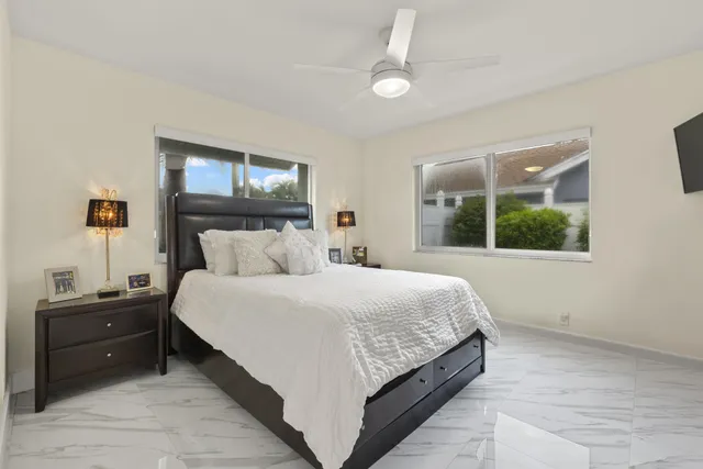 a bedroom with a bed and window