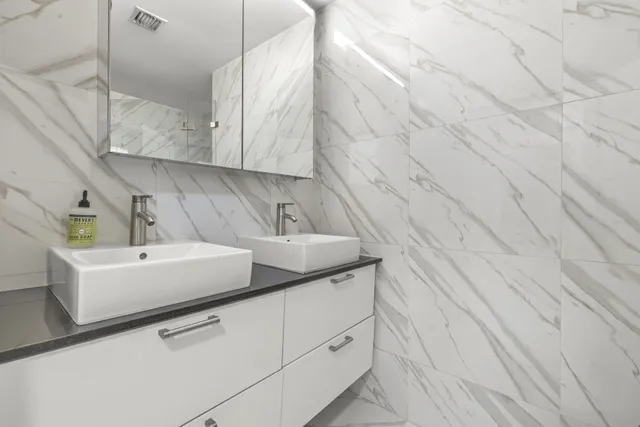 a utility room with cabinets washer and dryer