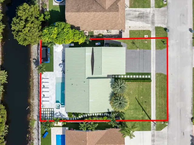 a bird view of a house with a yard