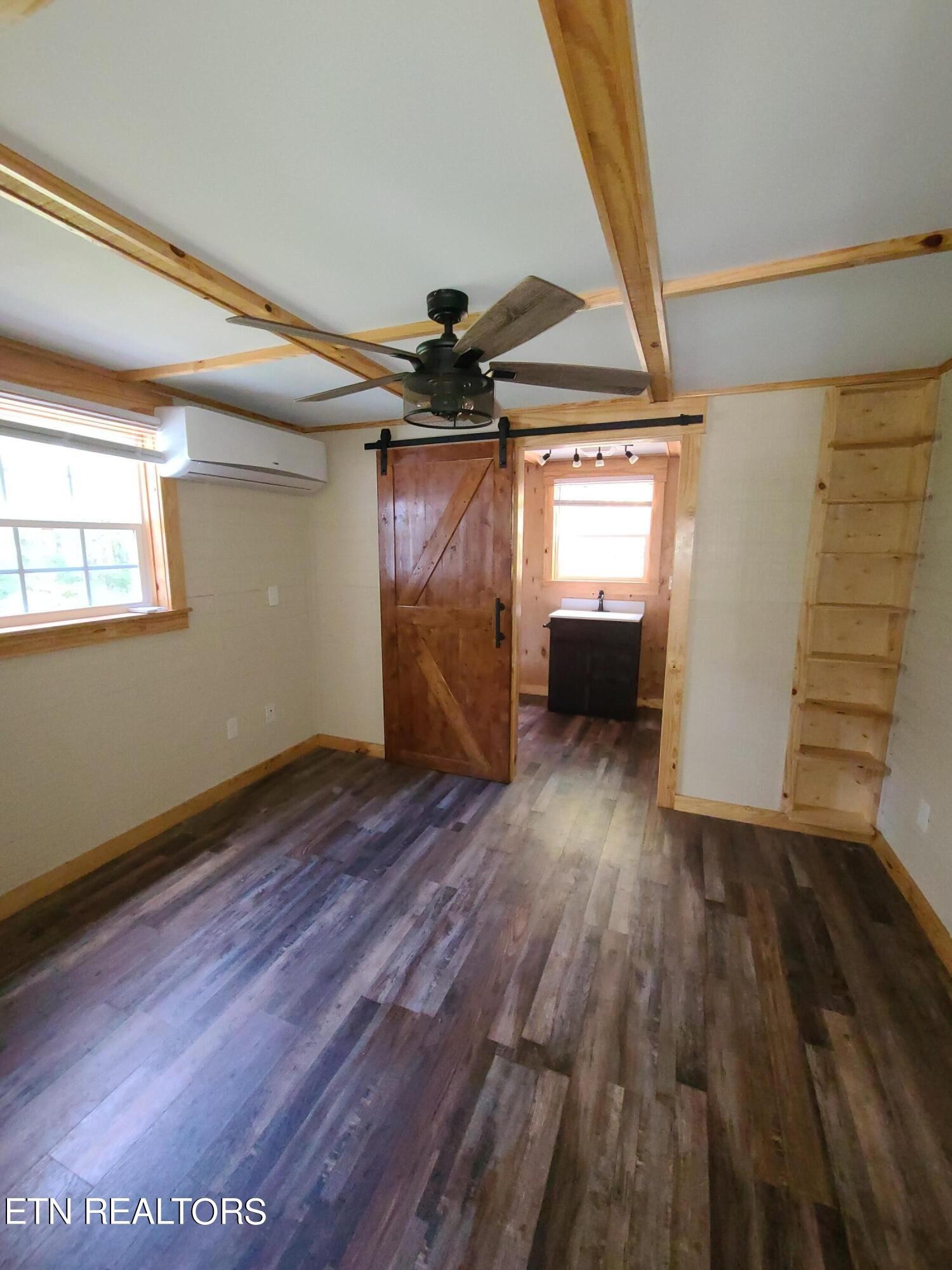 148 George Young Road Jamestown, TN 38556 - Photo 5 of 30 wooden floor in an empty room with a window