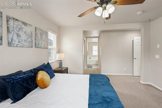 a bedroom with bed and window