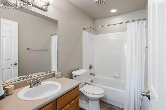 a bathroom with a sink toilet tub and shower