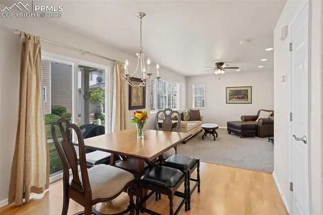 a view of a dining room with furniture window and wooden floor