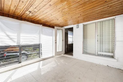 a view of entryway with wooden wall