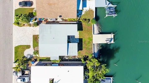 an aerial view of a house with swimming pool