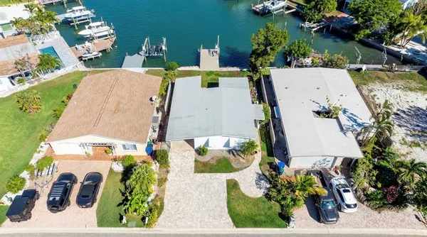 an aerial view of multiple house with outdoor space