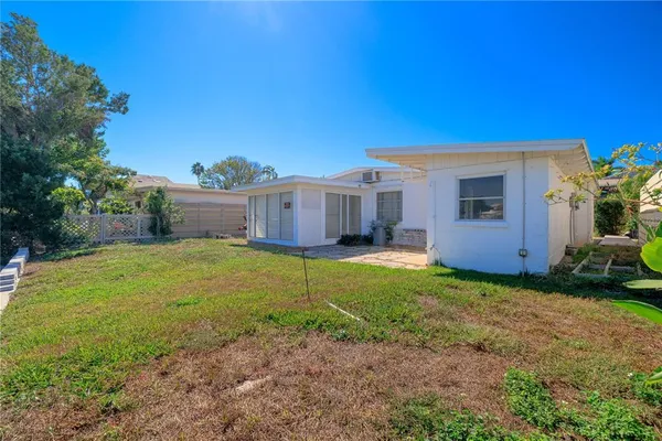 a front view of a house with a yard and a garage