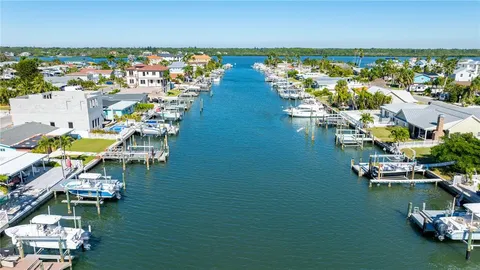 an aerial view of a ocean with boats