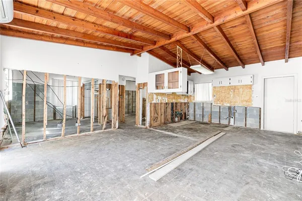 a view of a room with wooden walls