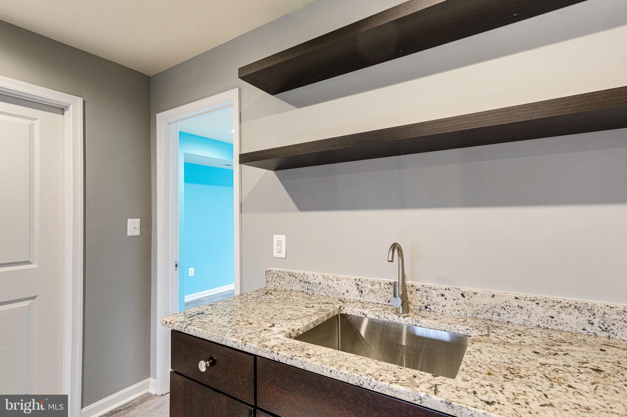 2508 Elvans Road Southeast Washington, DC 20020 - Photo 12 of 45 Wet bar has storage and new shelving.