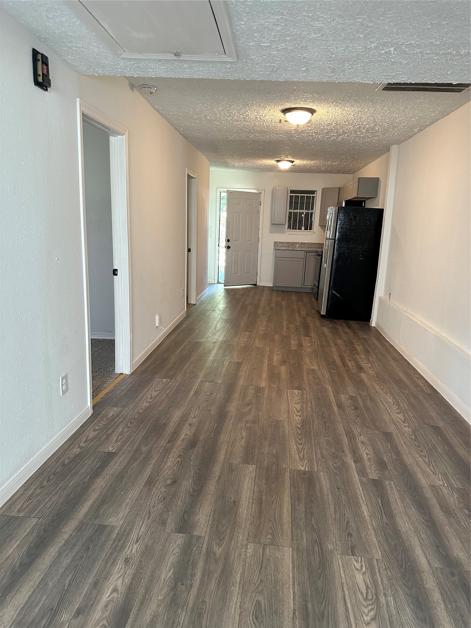 978 Ringold Street, Unit B Houston, TX 77088 - Photo 4 of 12 a view of empty room with wooden floor