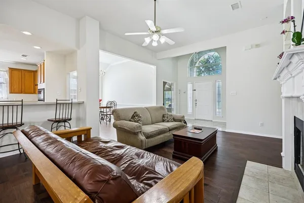 a dining room with furniture and wooden floor
