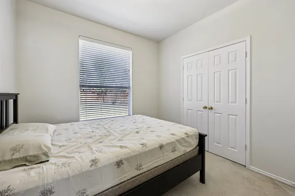 a bedroom with furniture and a chandelier