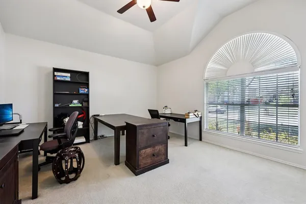 a view of a workspace with furniture
