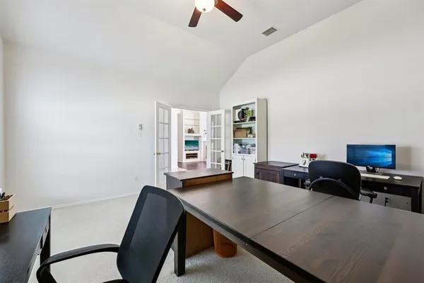 a living room with furniture fireplace and flat screen tv