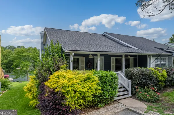 an aerial view of a house with a lake view