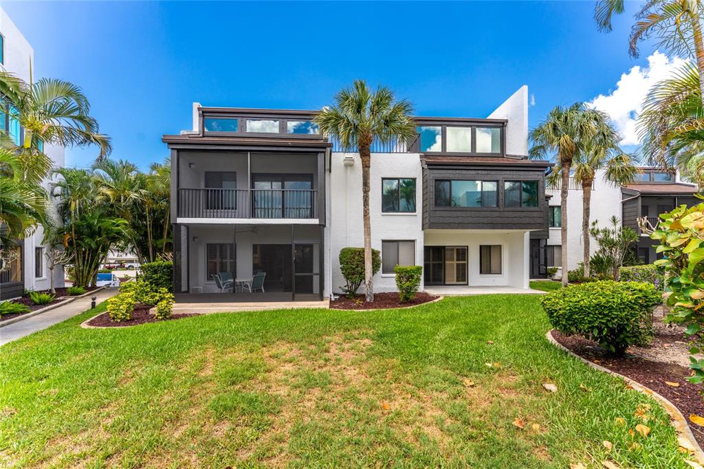 2955 North Beach Road, Unit B614 Englewood, FL 34223 - Photo 36 of 67 a front view of a house with a yard