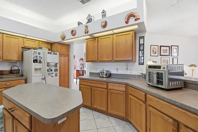 a kitchen with stainless steel appliances a sink a stove and a refrigerator
