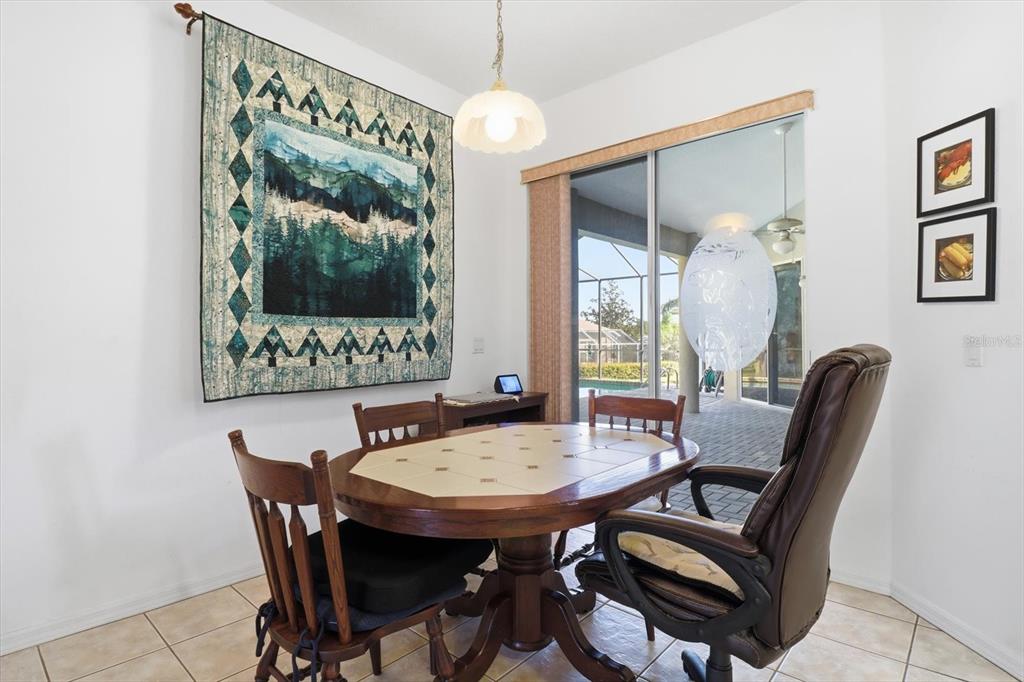 63 North Youngtree Point Lecanto, FL 34461 - Photo 15 of 48 a view of a dining room with furniture window and wooden floor