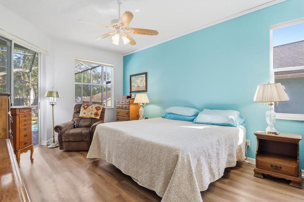 63 North Youngtree Point Lecanto, FL 34461 - Photo 20 of 48 a bedroom with a bed and wooden floor