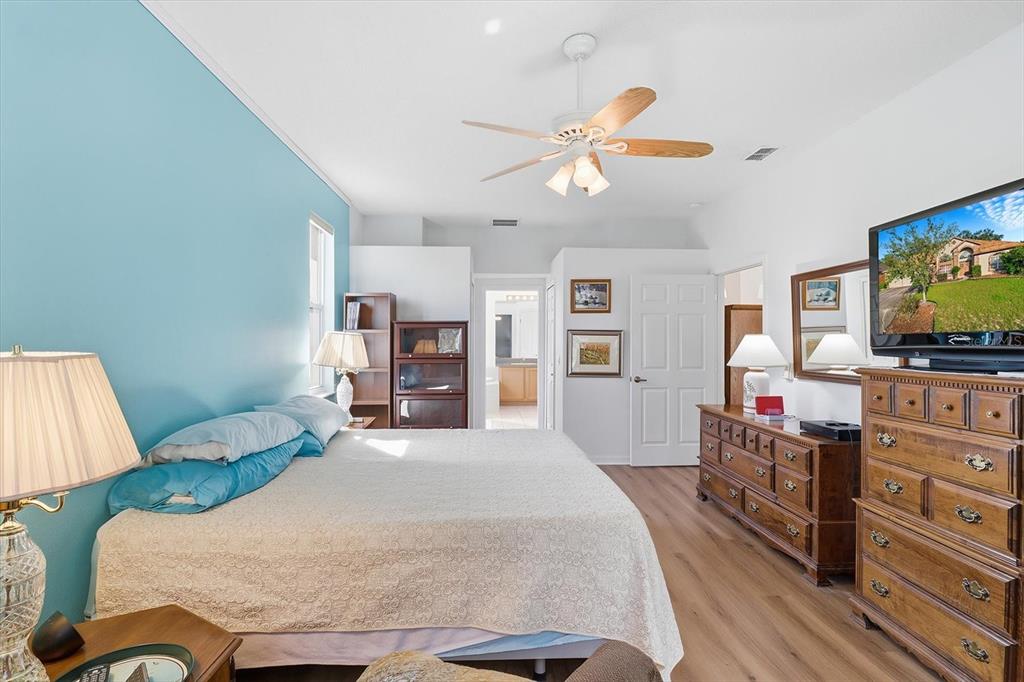 63 North Youngtree Point Lecanto, FL 34461 - Photo 21 of 48 a bedroom with a bed and furniture