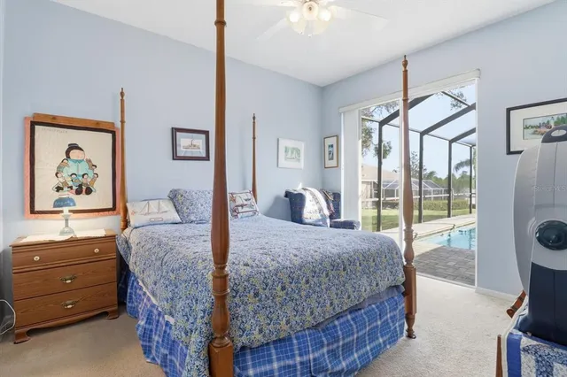 a bedroom with a bed and a dresser next to a window