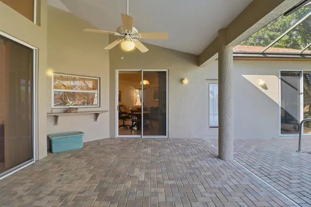 a view of a backyard with a swimming pool