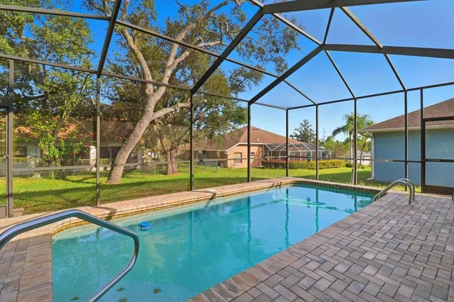 a view of a house with a backyard