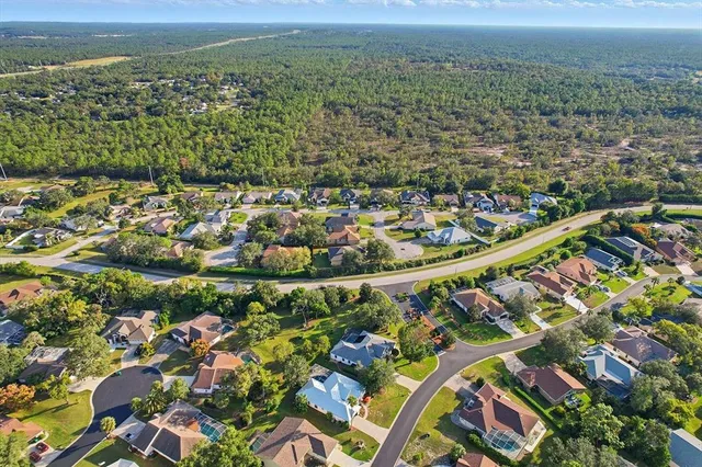 an aerial view of a house with a garden