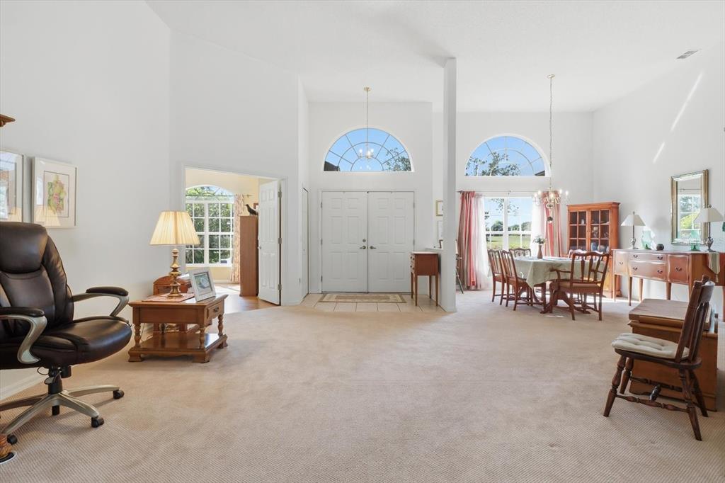 63 North Youngtree Point Lecanto, FL 34461 - Photo 7 of 48 a living room with furniture and a clock