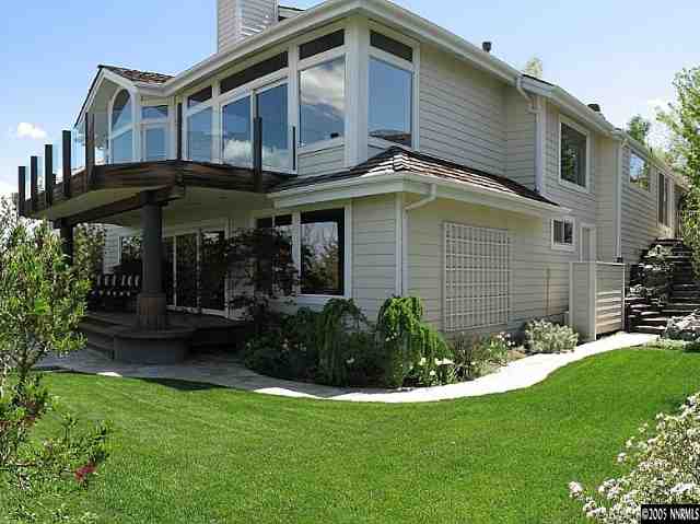 6107 Carriage House Way Reno, NV 89519 - Photo 3 of 9 a view of a house with a yard