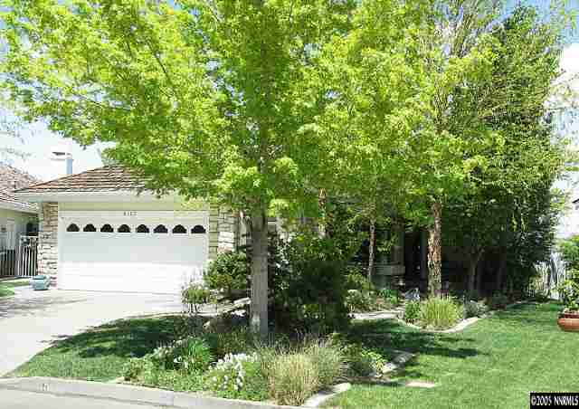 6107 Carriage House Way Reno, NV 89519 - Photo 4 of 9 a view of a house with a yard