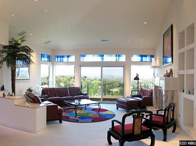 6107 Carriage House Way Reno, NV 89519 - Photo 5 of 9 a living room with furniture and a large window