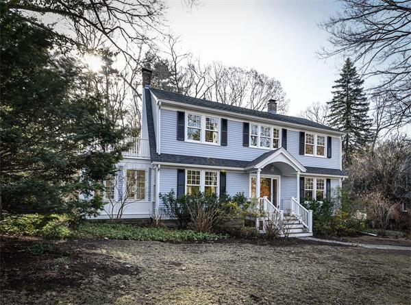 24 Hillside Road Wellesley, MA 02481 - Photo 1 of 17 a front view of a house with a garden
