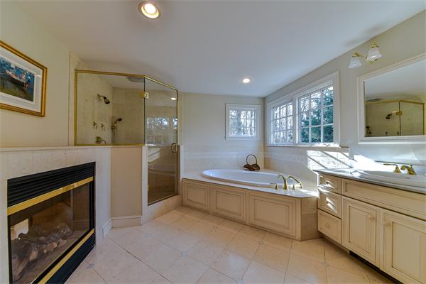 24 Hillside Road Wellesley, MA 02481 - Photo 12 of 17 a spacious bathroom with a tub sink shower and mirror