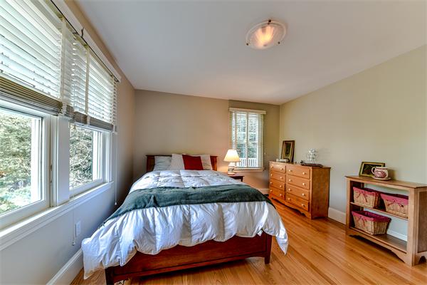 24 Hillside Road Wellesley, MA 02481 - Photo 13 of 17 a bedroom with a bed closet and a window