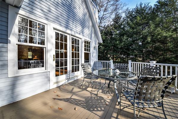 24 Hillside Road Wellesley, MA 02481 - Photo 16 of 17 a view of a patio with table and chairs with wooden floor and fence