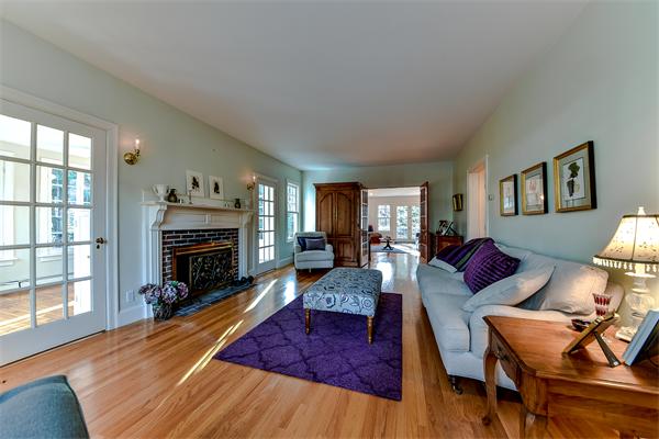 24 Hillside Road Wellesley, MA 02481 - Photo 3 of 17 a living room with furniture or couch and a fireplace