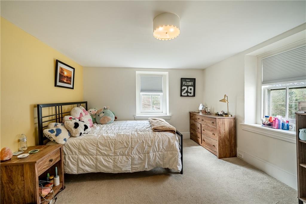 701 Oakbourne Road West Chester, PA 19382 - Photo 32 of 50 a bedroom with a bed and a table in it