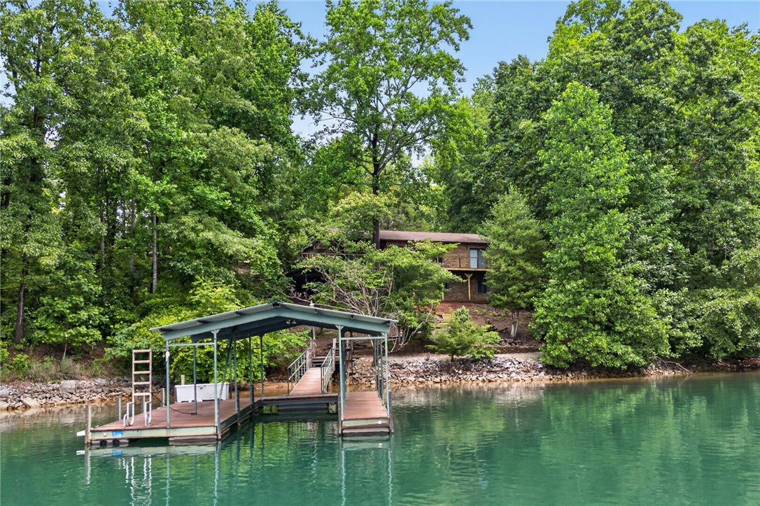 304 Lakeside Drive Seneca, SC 29672 - Photo 42 of 50 Dock offers direct water access to this wooded lakeside retreat.