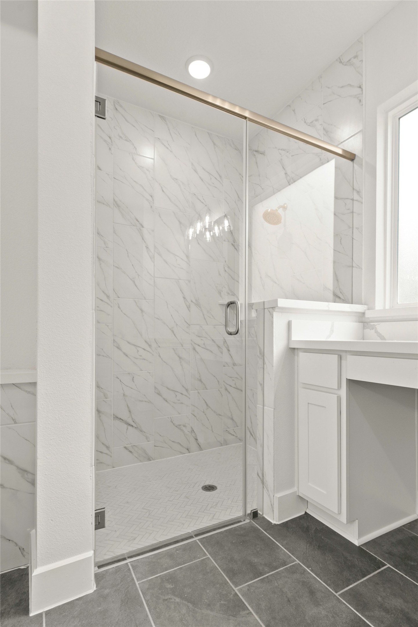 18917 Moonriver Street Conroe, TX 77302 - Photo 11 of 28 a bathroom with a shower and a glass door