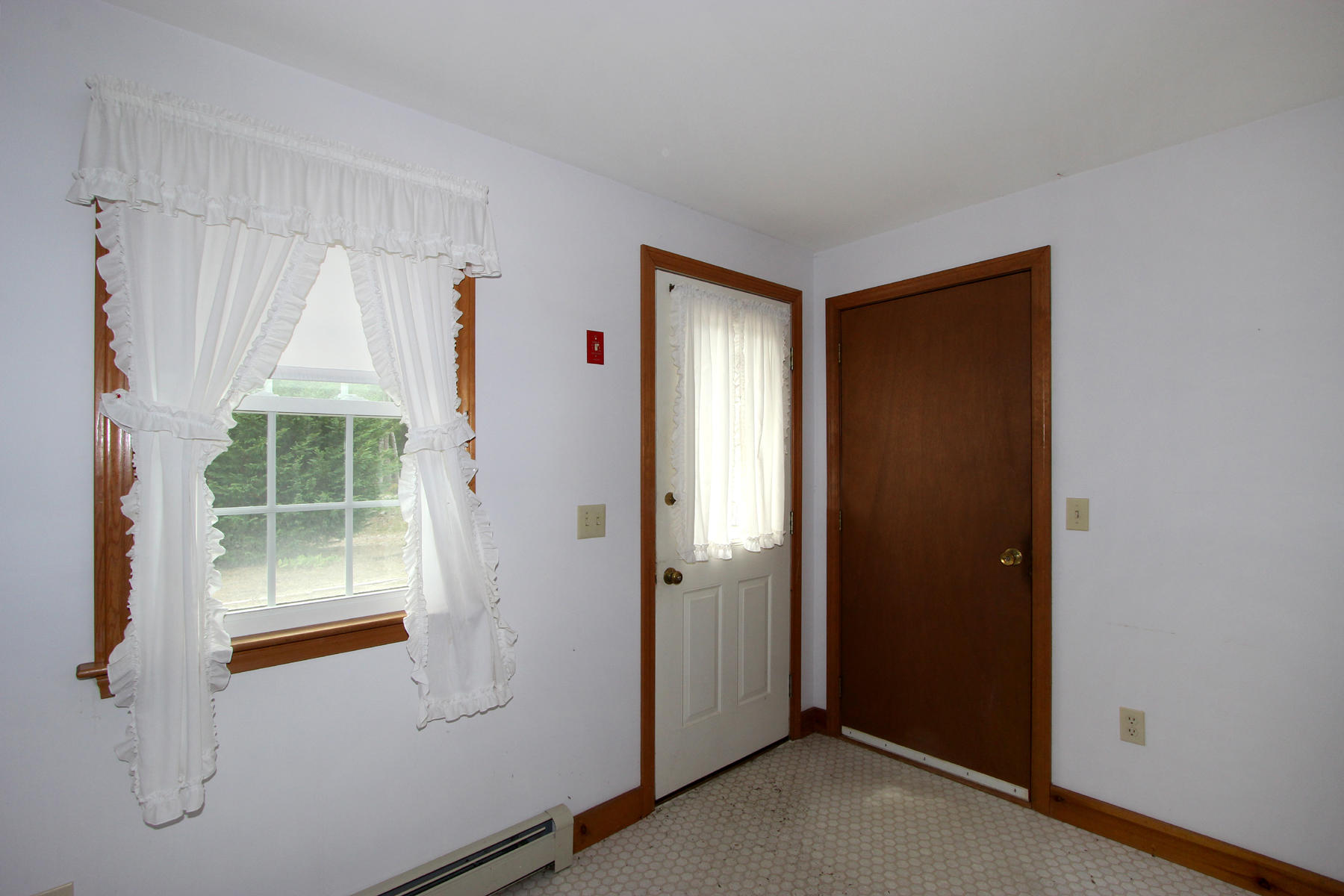 216 Cathedral Road Brewster, MA 02631 - Photo 13 of 56 a view of an empty room with a window