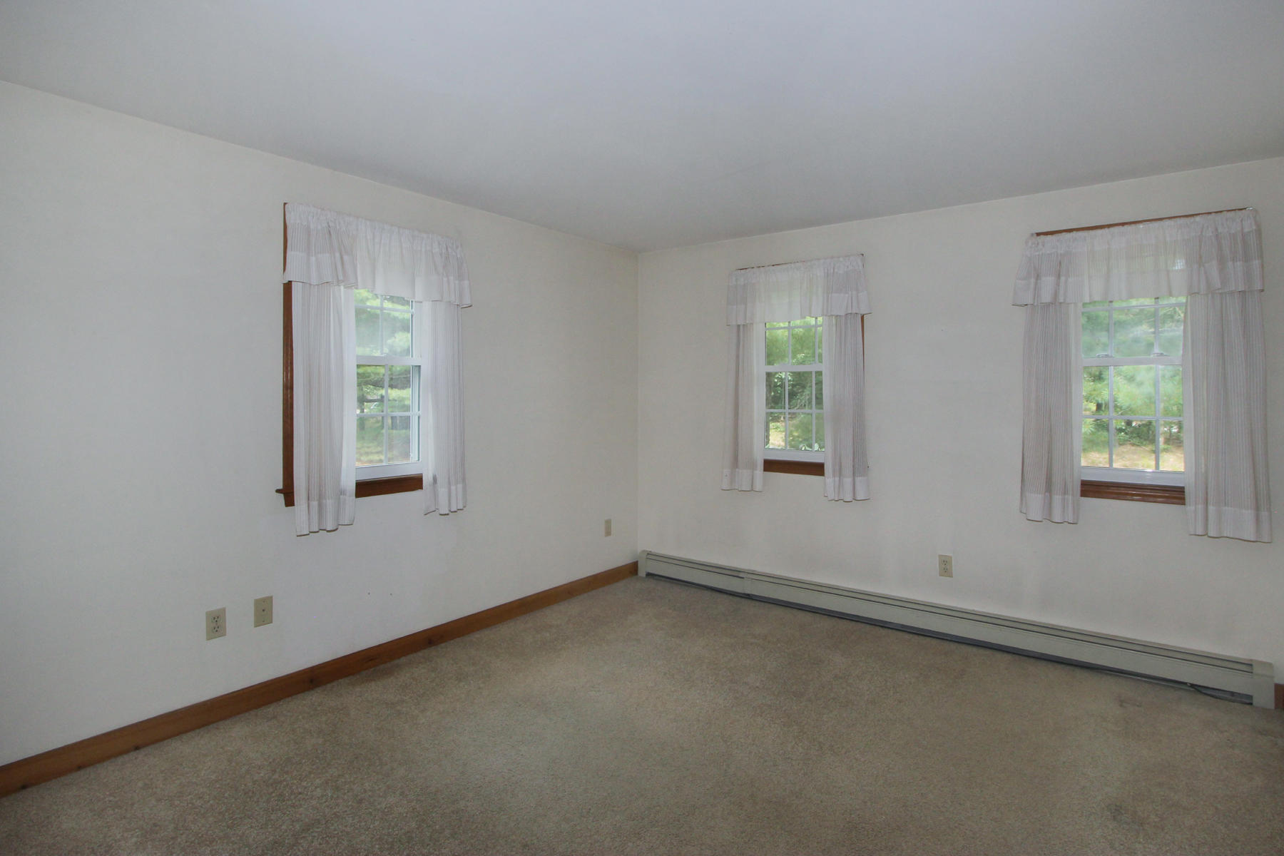 216 Cathedral Road Brewster, MA 02631 - Photo 18 of 56 an empty room with a window