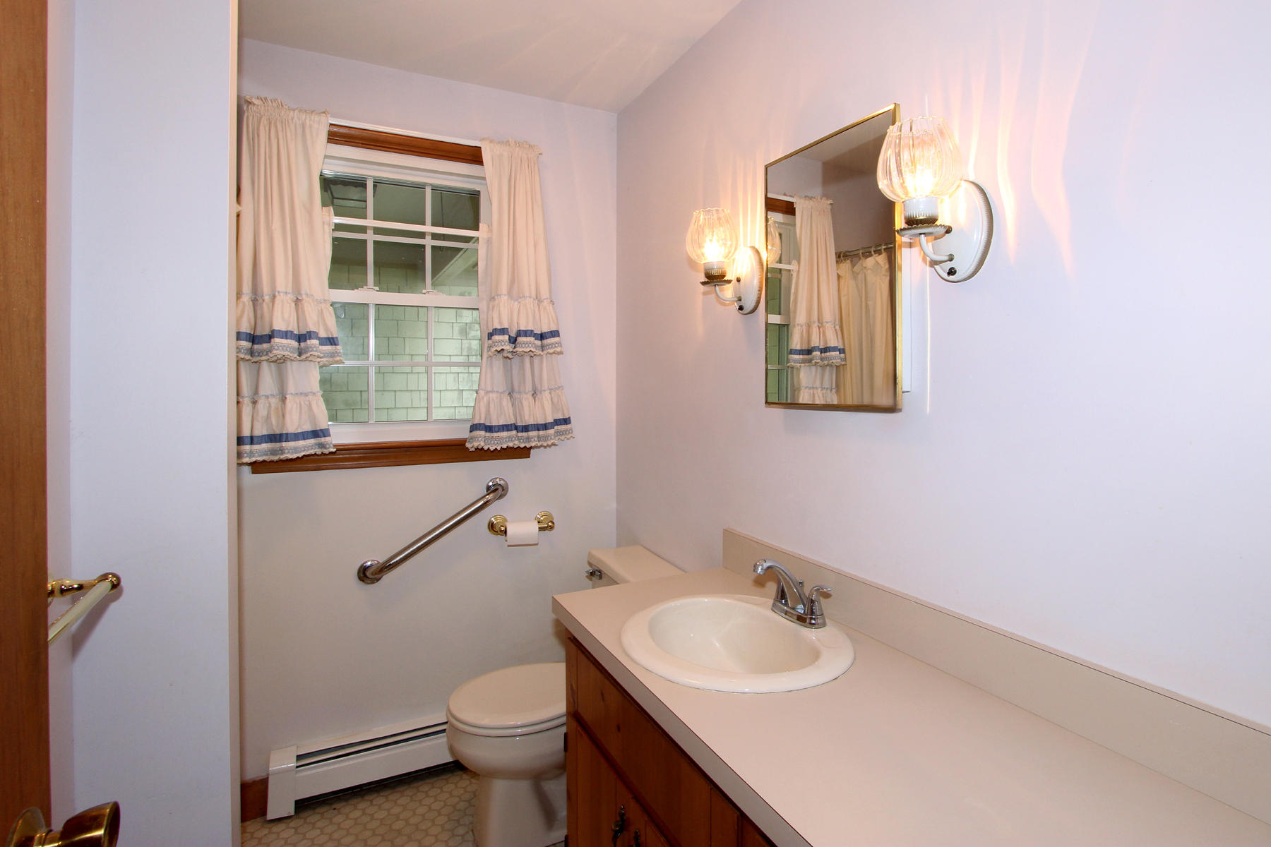 216 Cathedral Road Brewster, MA 02631 - Photo 20 of 56 a bathroom with a sink and a toilet
