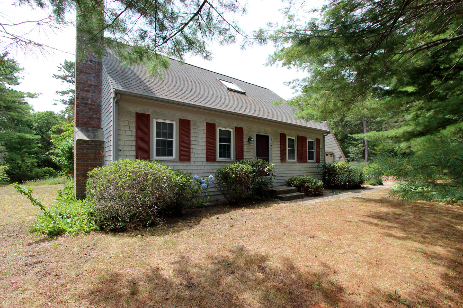 216 Cathedral Road Brewster, MA 02631 - Photo 2 of 56 a view of a house with backyard and garden