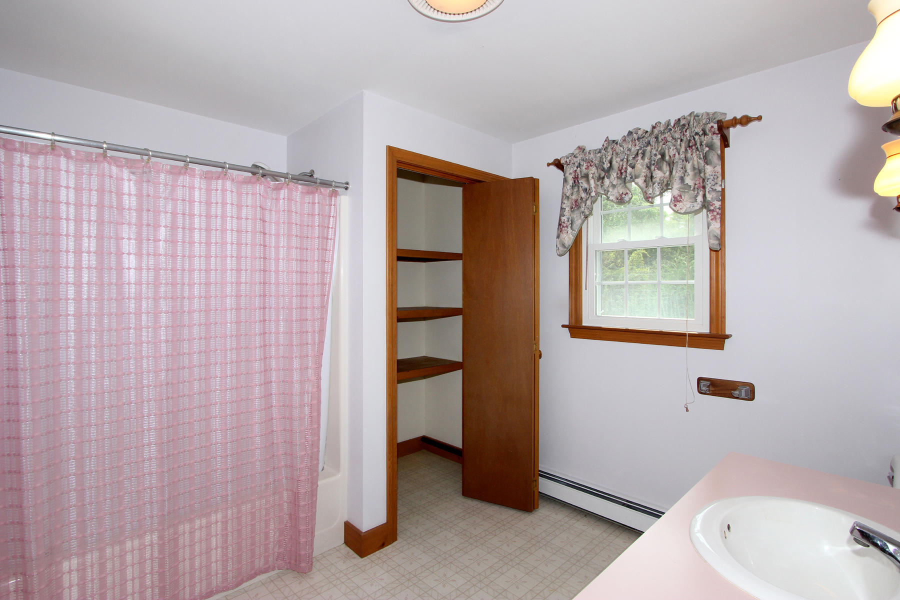 216 Cathedral Road Brewster, MA 02631 - Photo 29 of 56 a bathroom with a sink and a mirror