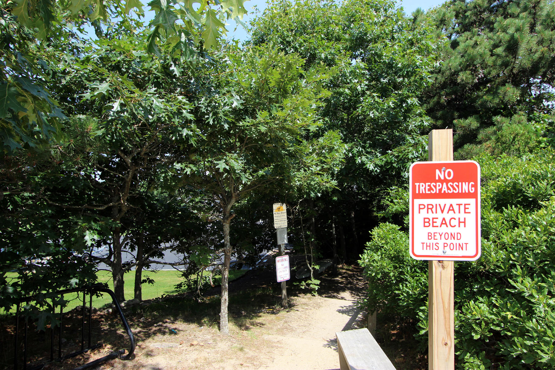 216 Cathedral Road Brewster, MA 02631 - Photo 32 of 56 a sign that is on a pole